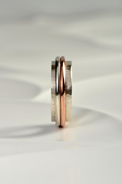 chunky handmade sterling silver hammer textured ring for a man with a rose gold detail from Christine Sadler