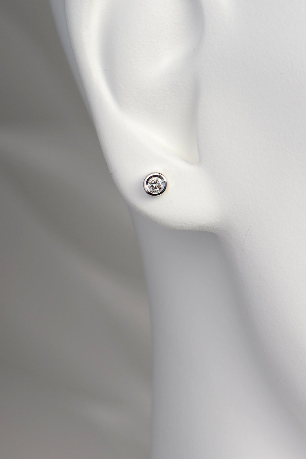 round lab diamond white gold earrrings in model's ear to show size and scale - Christine Sadler