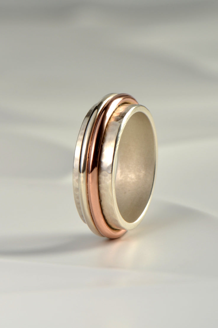 modern silver and rose gold ring for a man with a hammered texture by Christine Sadler
