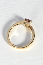 top view of modern gold ring that has a 0.60ct pink sapphire in a heart cut shape - Christine Sadler