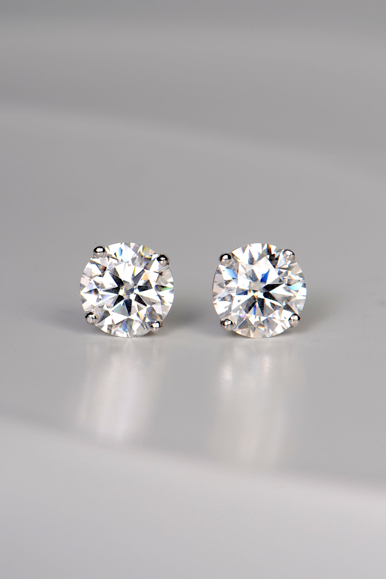 a pair of lab grown gemstone earrings