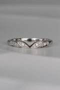 handmade platinum wedding ring with four leaf details at the front with three diamonds set in each leaf. Handmade in the UK