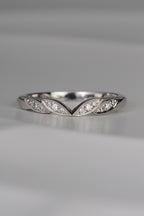 handmade platinum wedding ring with four leaf details at the front with three diamonds set in each leaf. Handmade in the UK