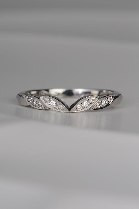 handmade platinum wedding ring with four leaf details at the front with three diamonds set in each leaf. Handmade in the UK