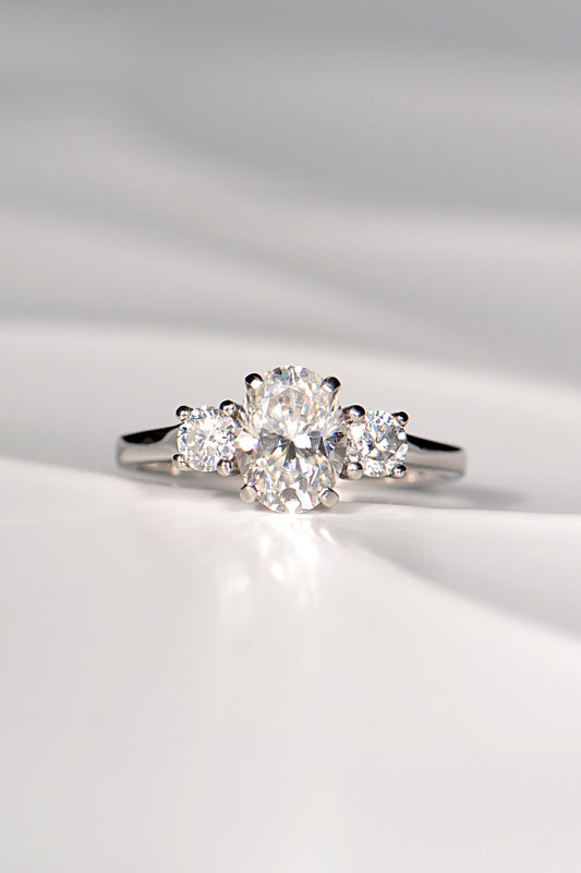 Moissanite platinum trilogy engagement ring