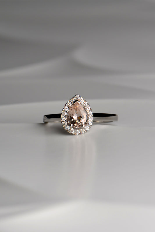 Platinum morganite and diamond pear cut halo ring