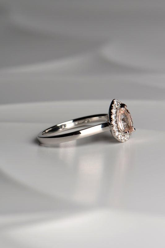 Platinum morganite and diamond pear cut halo ring