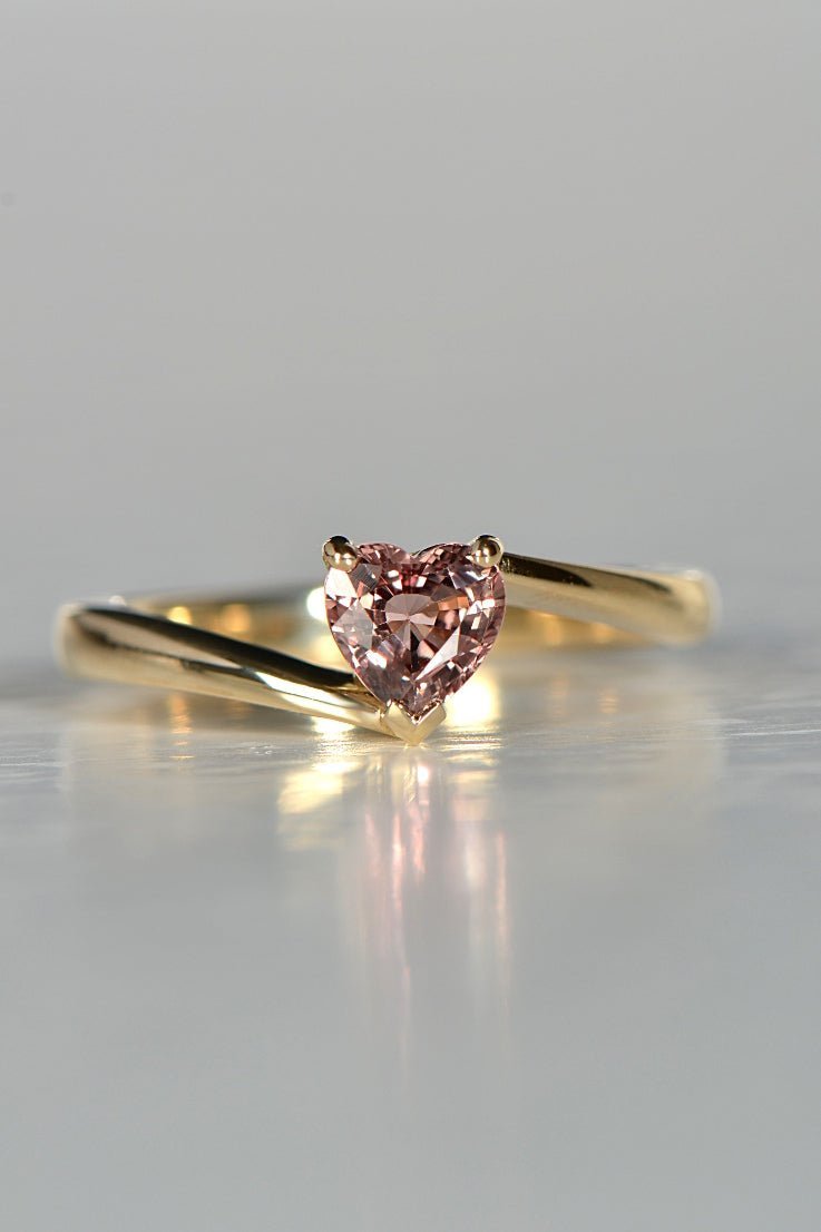 delicate gold ring set with a warm pink heart cut sapphire - Christine Sadler