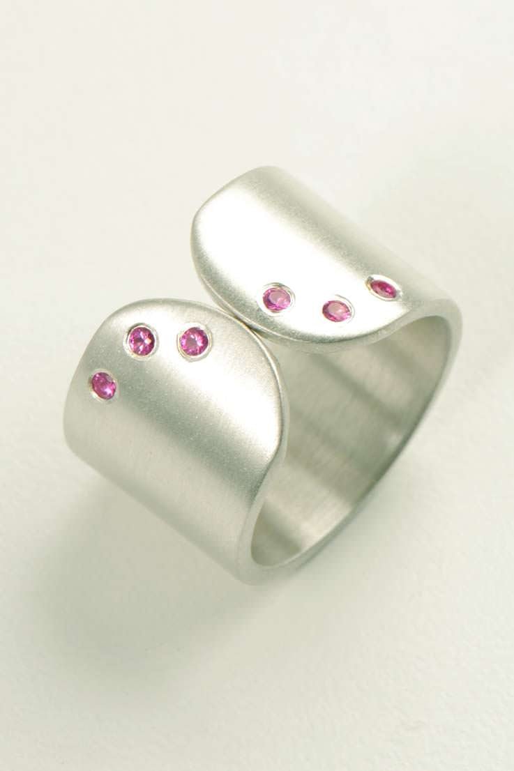 Handmade silver ring with pink sapphires by British jewellery designer Christine Sadler