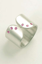 Handmade silver ring with pink sapphires by British jewellery designer Christine Sadler