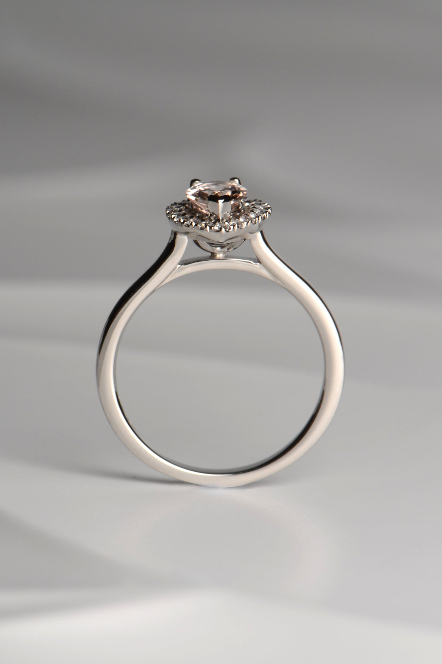 Platinum morganite and diamond pear cut halo ring