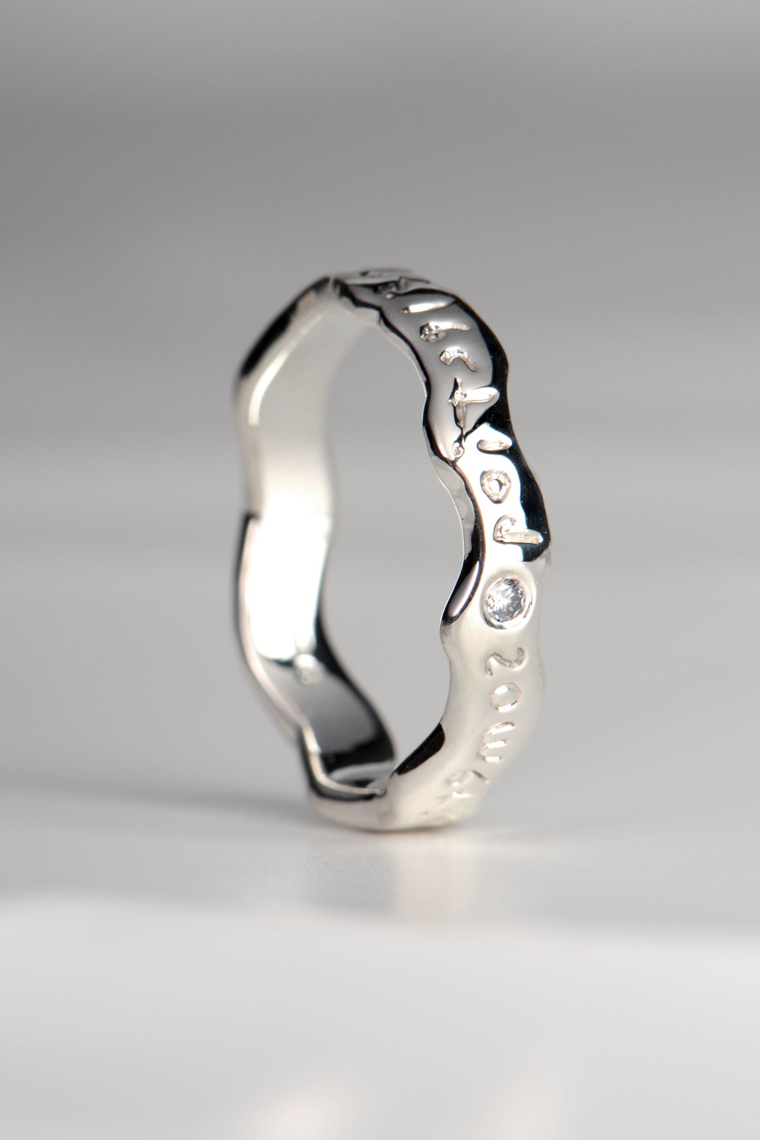 designer ring with hidden meaning set with a diamond by Christine Sadler