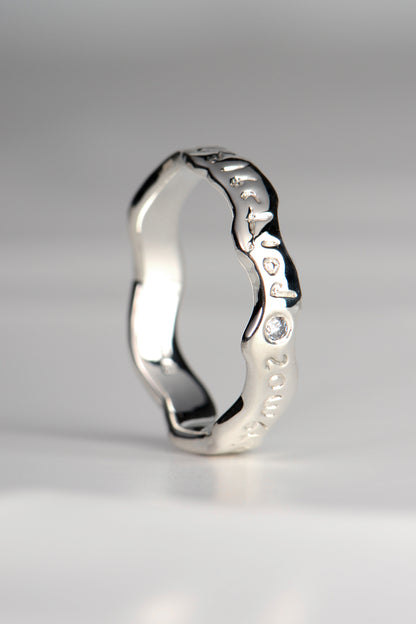 designer ring with hidden meaning set with a diamond by Christine Sadler