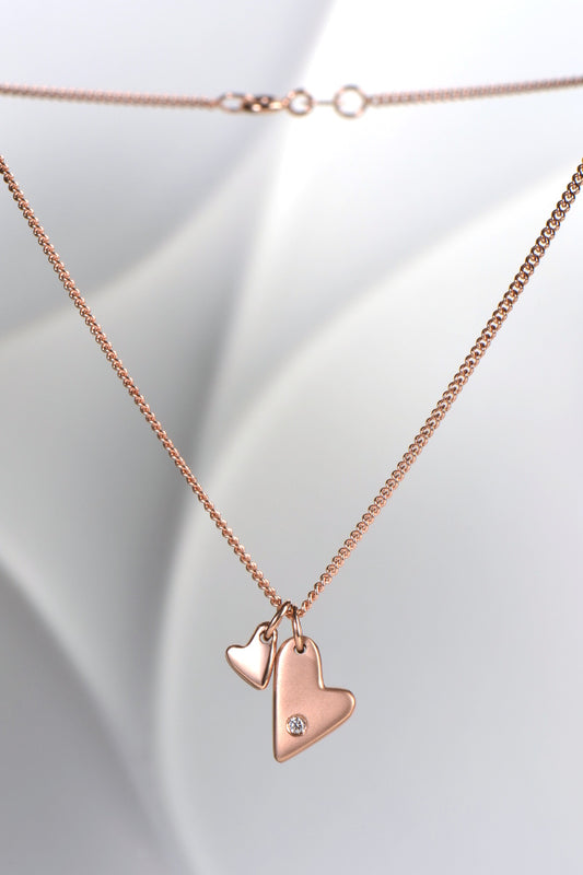 From The Heart 9ct rose gold two heart diamond pendant