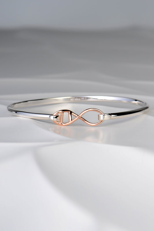 Designer genes silver and rose gold bangle