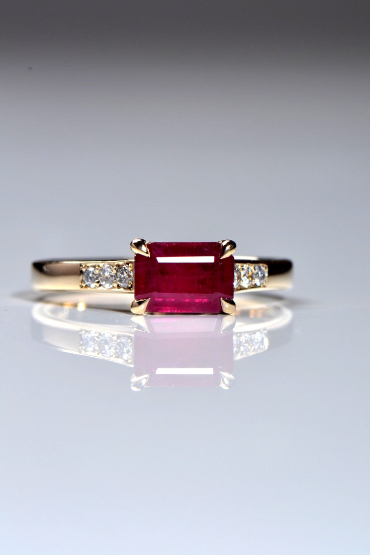Radiant cut ruby with diamonds in 18ct yellow gold
