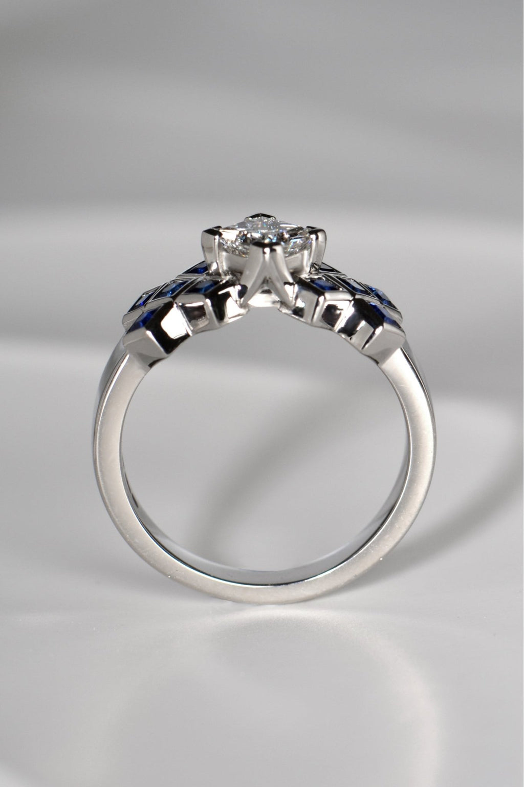 The diamond in the tartan ring is set higher than the sapphires so it looks like a rock rising out of a sapphire sea.This Scottish diamond ring design is available exclusively from Christine Sadler.