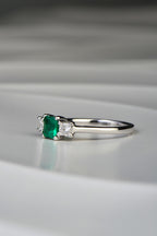 princess cut three stone emerald and diamond engagement ring by Scottish jewellery designer Christine Sadler