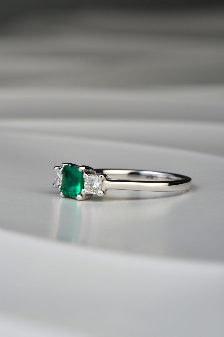 princess cut three stone emerald and diamond engagement ring by Scottish jewellery designer Christine Sadler