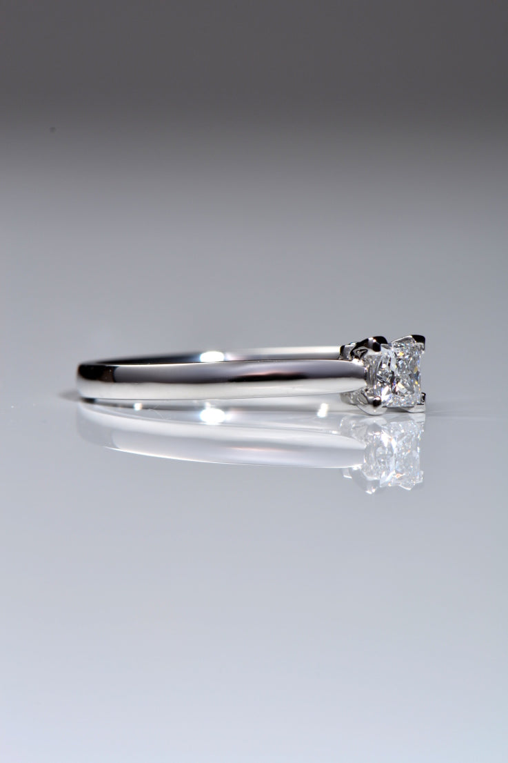Platinum princess cut diamond ring with blue diamonds
