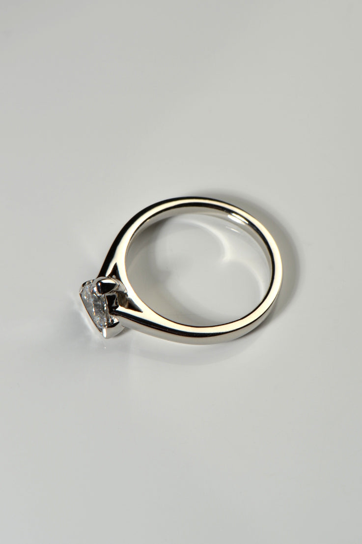 view of the trillion cut sailing stone ring from the claw side