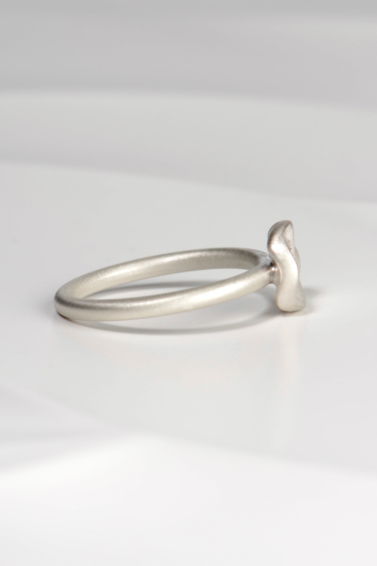 modern delicate brushed silver designer ring with a diamond exclusively available from Christine Sadler