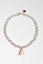 Sterling silver bracelet with two highly polished 9ct rose gold hearts — large front heart and small heart by secure lobster clasp, From The Heart collection