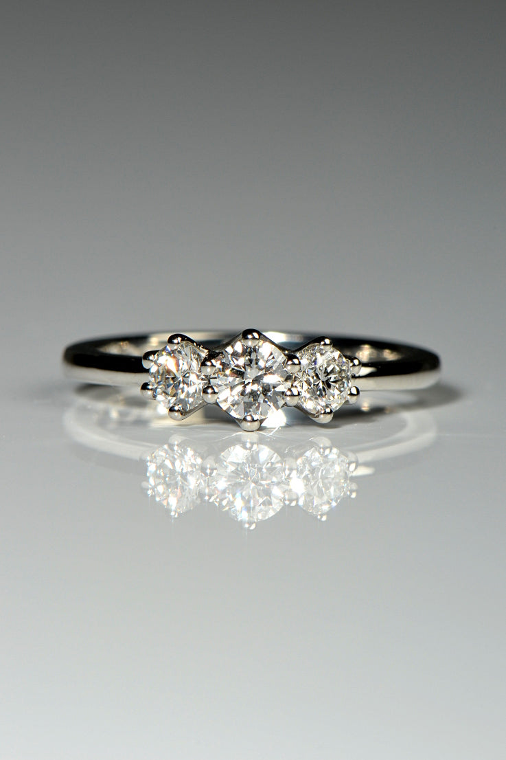 three stone platinum ring with cathedral setting