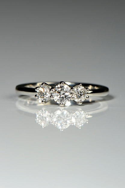 three stone platinum ring with cathedral setting