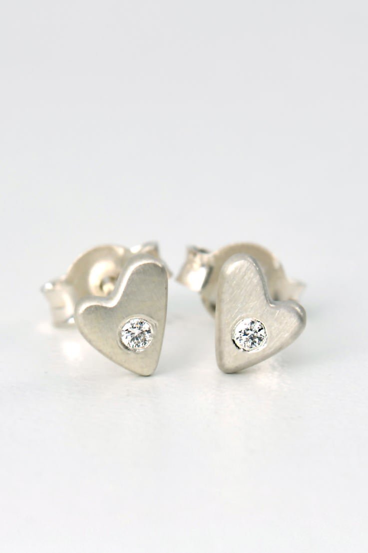 silver diamond heart stud earrings with matt finish displayed on a white background from the From The Heart collection by Christine Sadler