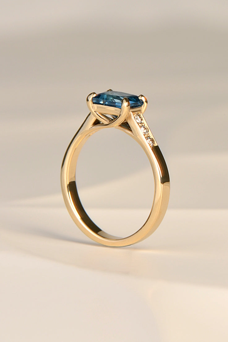 Blue topaz and diamond radiant ring.