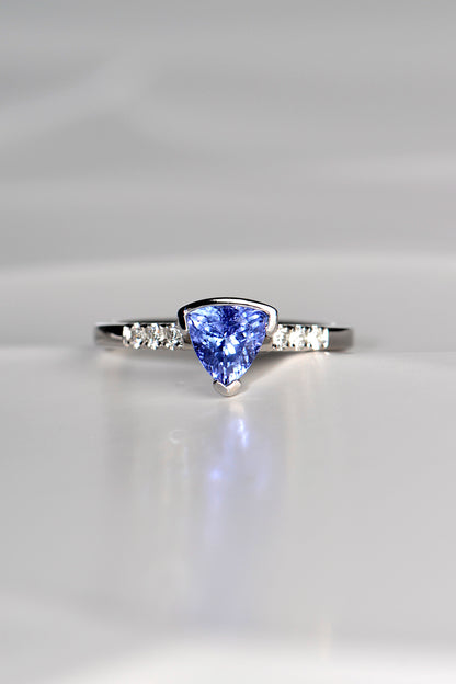 trillion cut tanzanite ring with three diamonds on either side exclusively available from fine jewellery designer Christine Sadler