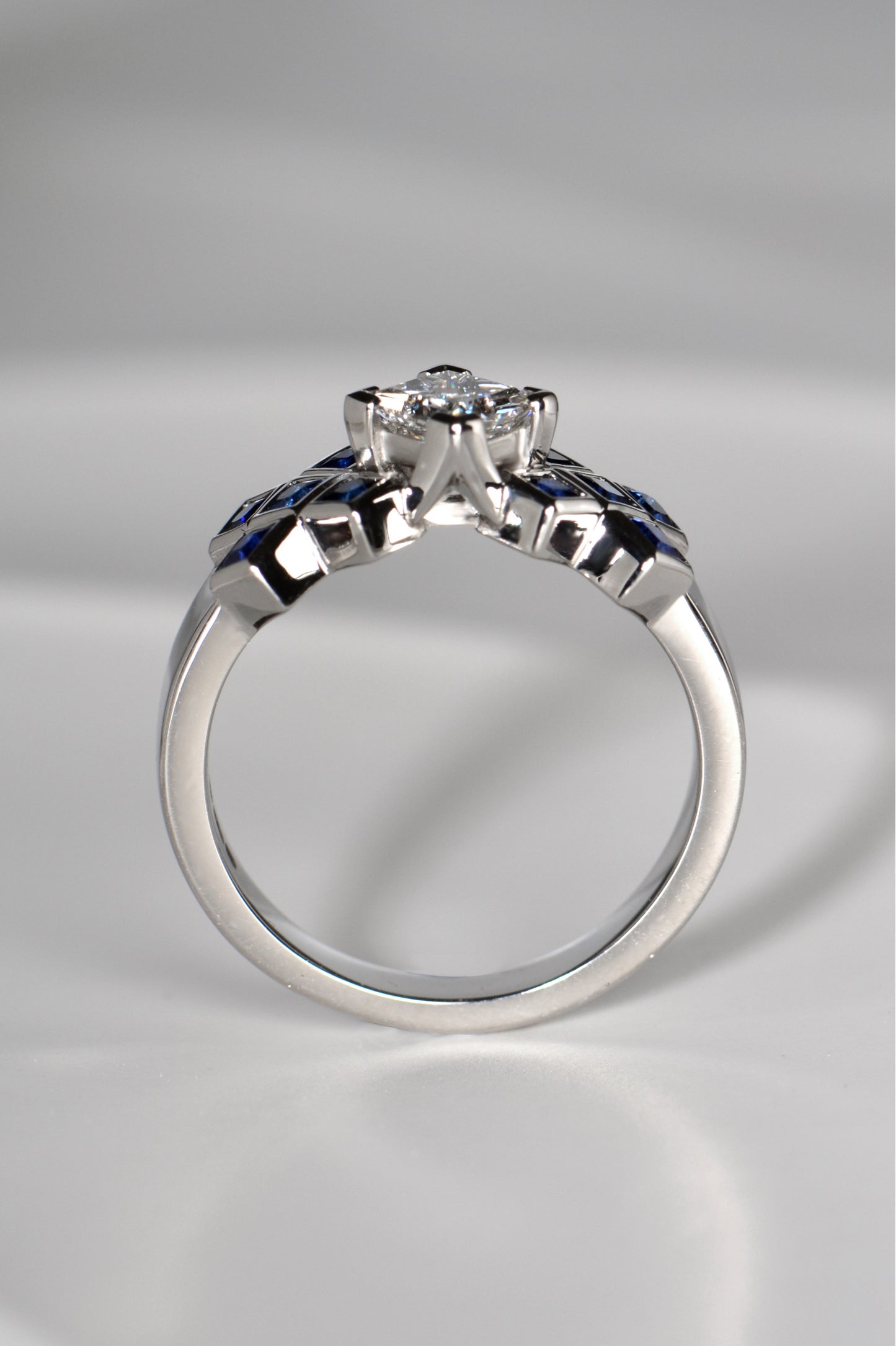 The diamond in the tartan ring is set higher than the sapphires so it looks like a rock rising out of a sapphire sea.This Scottish diamond ring design is available exclusively from Christine Sadler.