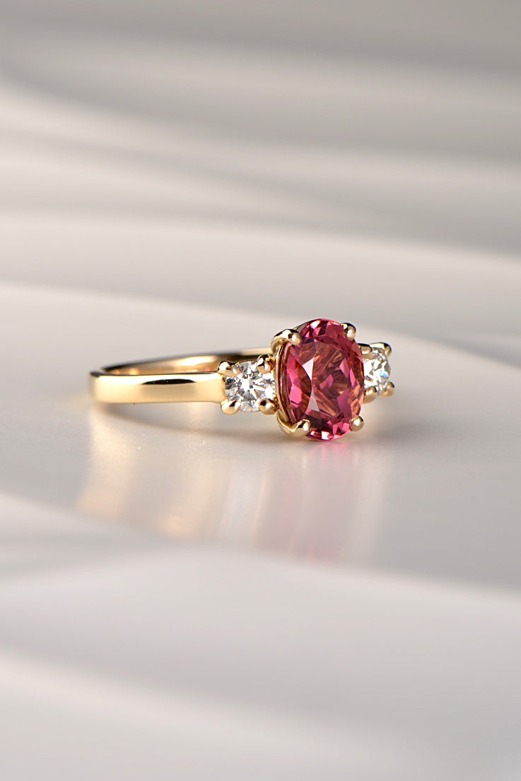 Fuchsia pink oval cut tourmaline and diamond ring