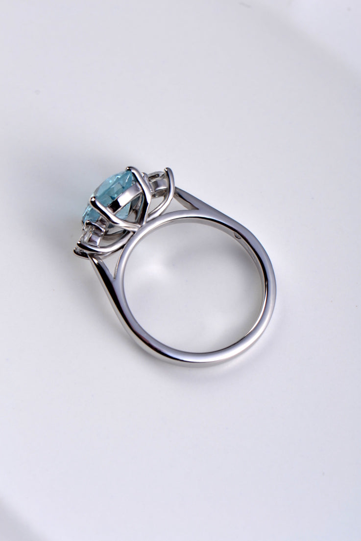 Platinum aquamarine and diamond three stone ring