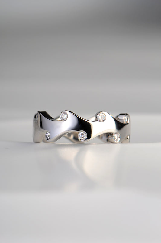 Modern platinum diamond set ring inspired by fire exclusively from jewellery designer Christine Sadler. This ring can be worn as a wedding or eternity ring or even a right hand ring.